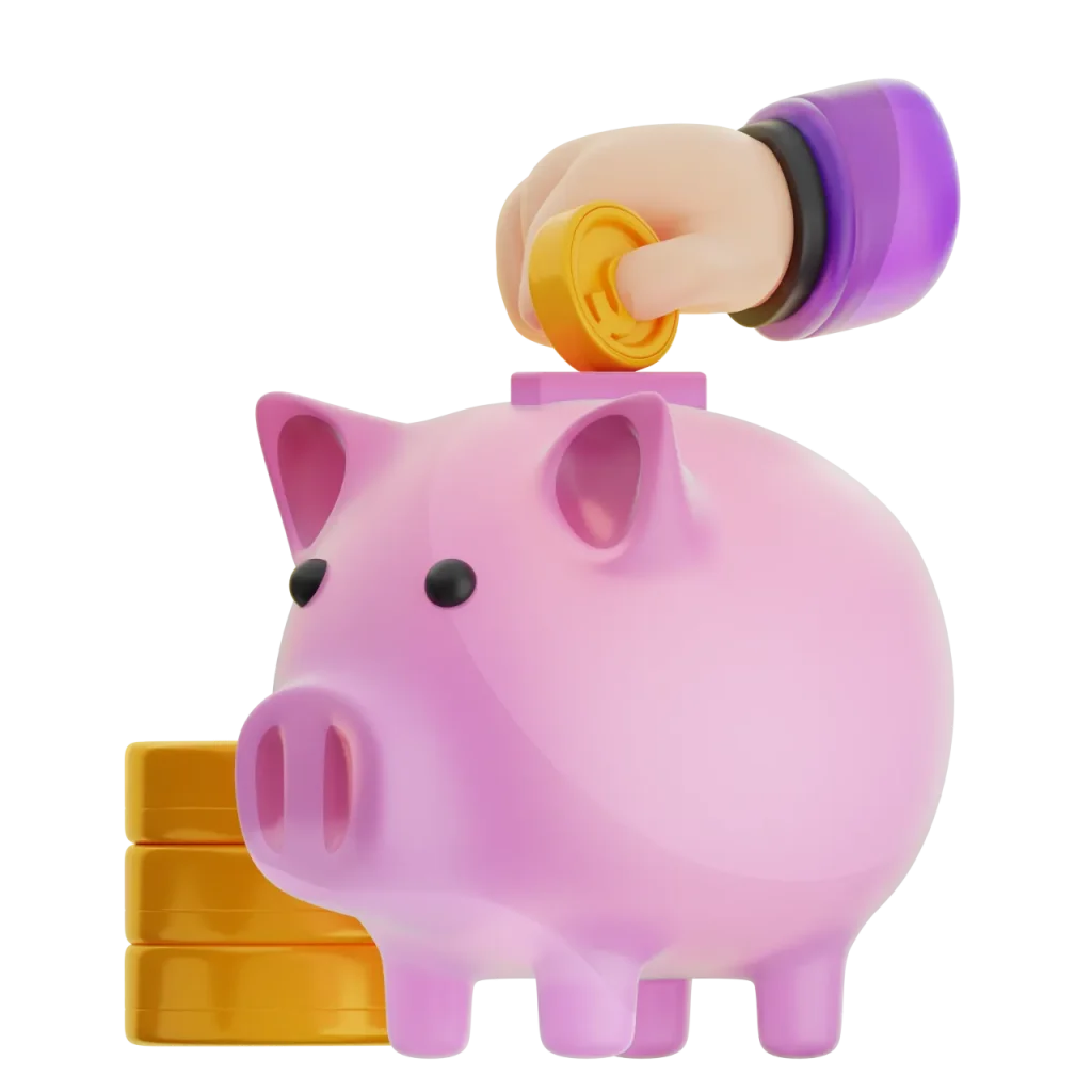 Hand putting coins into a piggy bank with more coins beside it